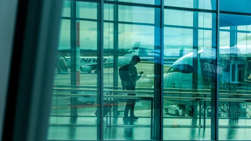 Passenger on their phone at airport