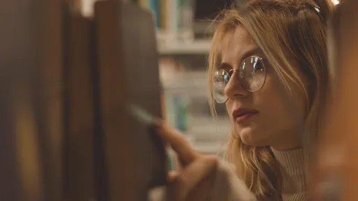 Woman looking at books in a library